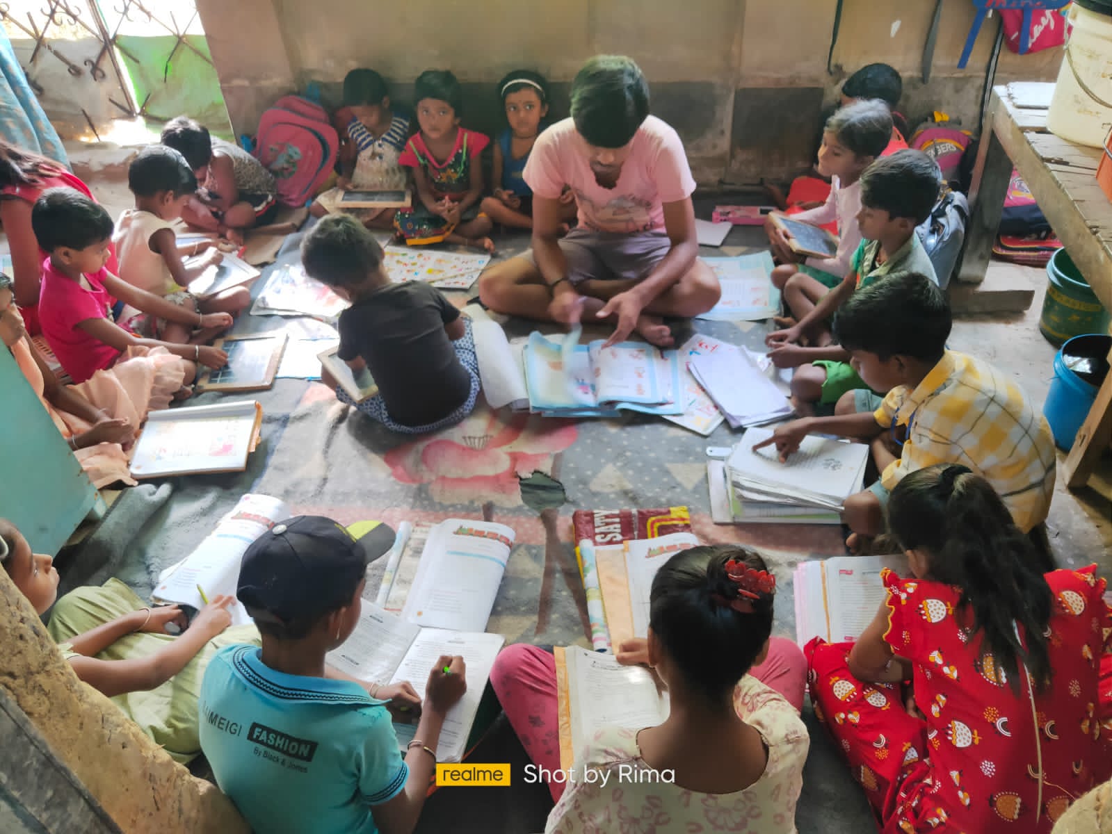 Children and adults taking part in a shared drawing activity